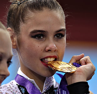 photography of girl holding gold medal HD wallpaper