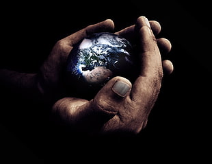 hand holding earth illustration