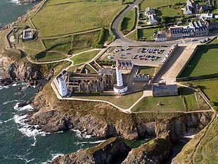 white and grey concrete house with lighthouse, lighthouse, aerial view, Pointe Saint-Mathieu, Brittany