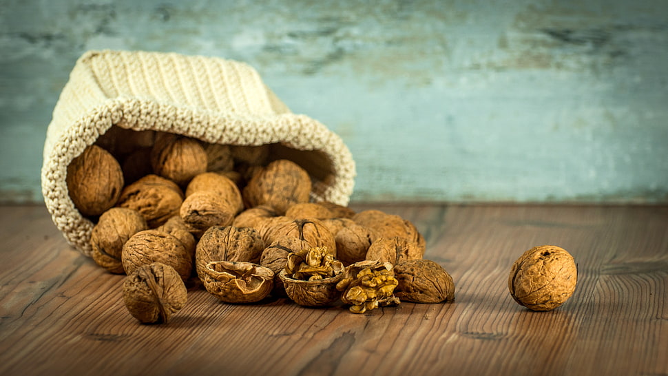 nuts filled sack shallow focus photo HD wallpaper