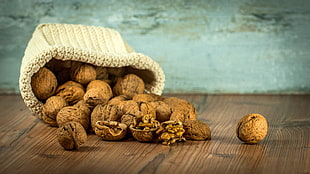 nuts filled sack shallow focus photo HD wallpaper