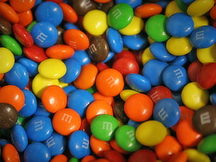 blue, red, black, yellow and green M&M chocolates