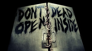 brown wooden base with Dont Open dead inside signage