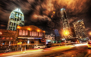 time lapse photography of cars and city buildings during nighttime