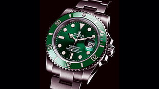 round green analog Rolex watch with silver link