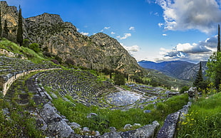 landscape photo of stair surrounded by grass near mountain