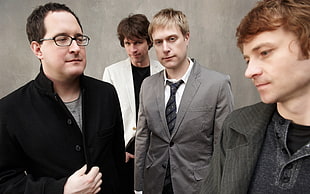 group of men wearing formal suit jacket