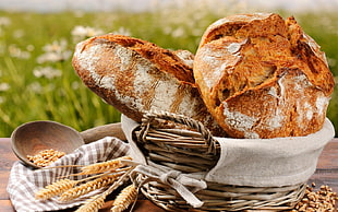 two brown breads on brown wicker basket