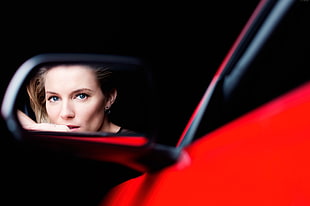 woman looking at red vehicle wing mirror HD wallpaper