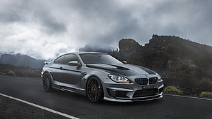 gray BMW coupe on gray asphalt road during daytime HD wallpaper