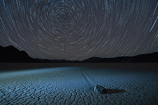 rock in the middle of cracked ground, racetrack playa, death valley national park, california