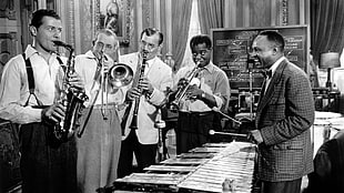 vintage photo of four men playing wind instruments