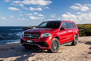 red Mercedes-Benz sport utility vehicle