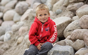 child wearing red jacket