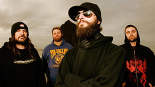 group of men wearing hoodies
