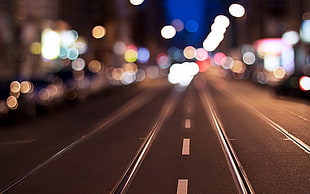 selective focus photography of black asphalt road