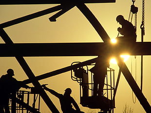 silhouette of people on skyscraper, workers, construction, sunlight, silhouette
