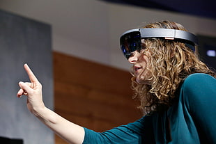 woman in blue shirt with VR glasses
