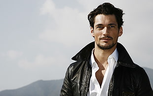 man wearing black leather jacket during daytime HD wallpaper