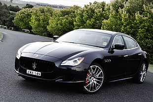 black Maserati sedan on gray concrete road HD wallpaper
