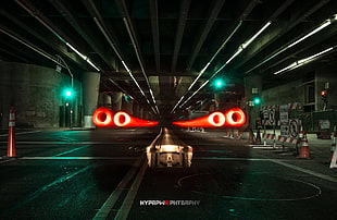 time lapse photography of red lights at garage