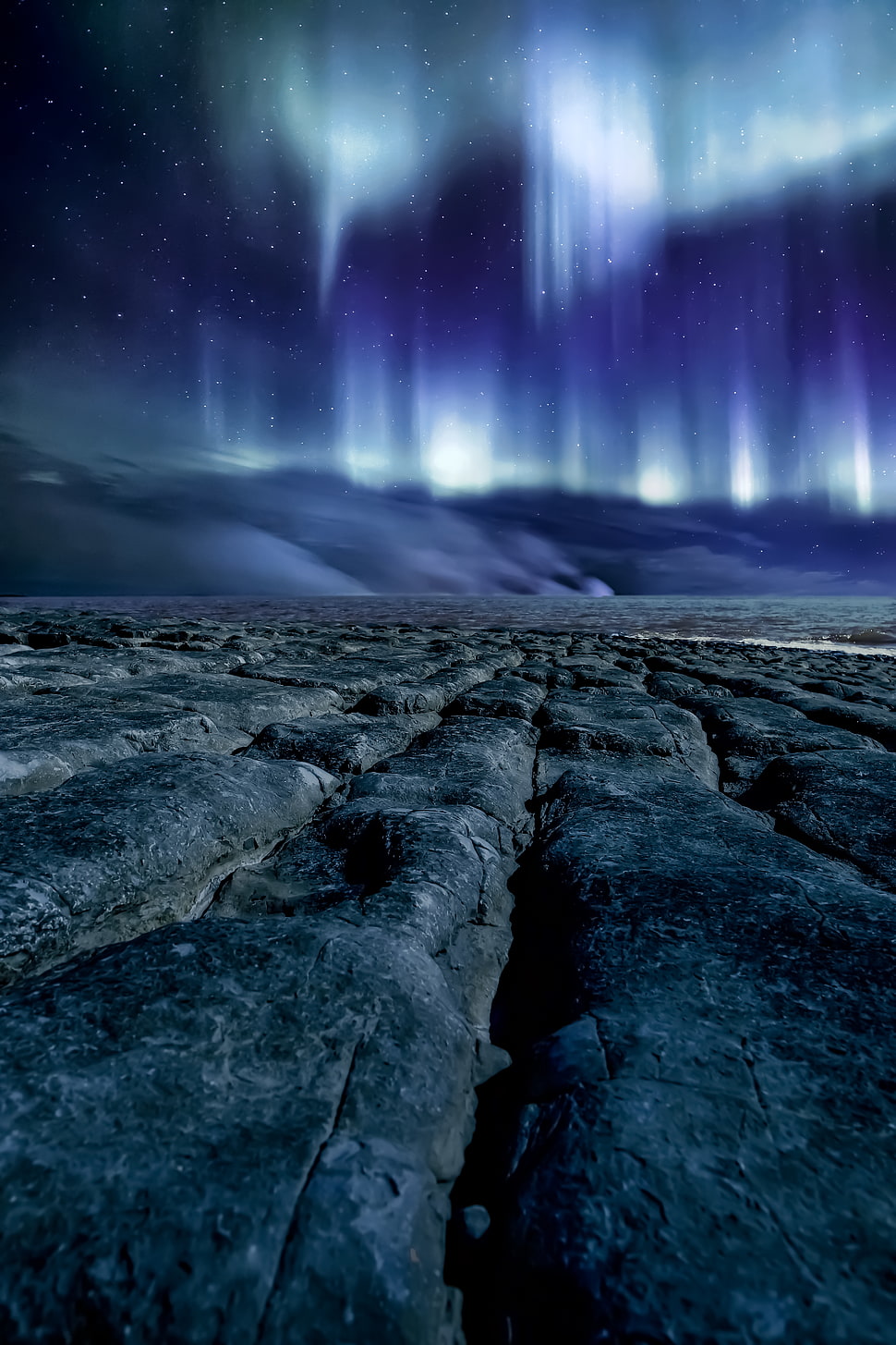 grey field near mountain at nightime HD wallpaper