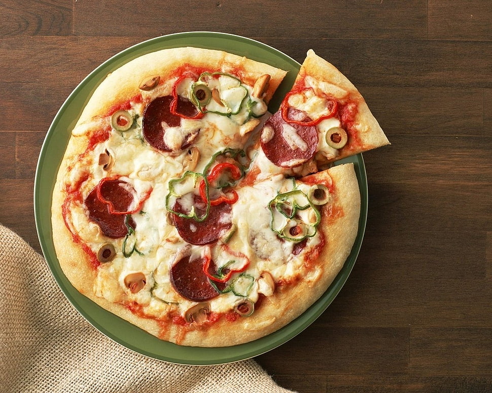 pepperoni pizza on top of table HD wallpaper