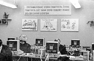 grayscale photo of room with people