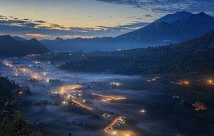 aerial photography of city covered with fogs