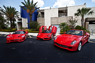 three red sports cars