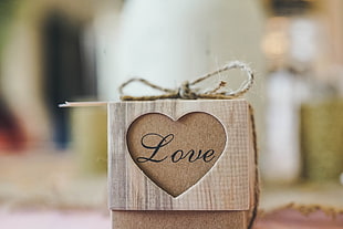 brown wooden box with Love print selective focus photo