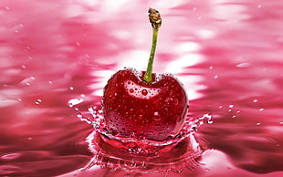 close-up photography of Cherry fruit dump on water