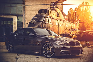 black BMW sedan near building HD wallpaper