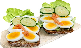 sliced eggs beside green cabbage