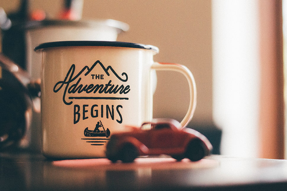 white ceramic mug with The Adventure Begins print HD wallpaper