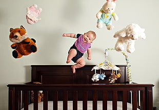 baby floating with plush toys photo HD wallpaper