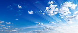 photo of clear blue skies with white clothes during day time