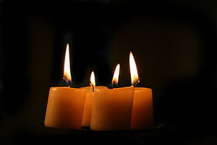 photo of four lighted candles