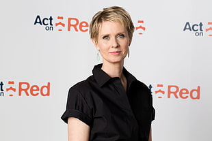 photo woman wearing black dress shirt with Act On Red background