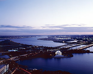 aerial view of lighted buildings and bridges