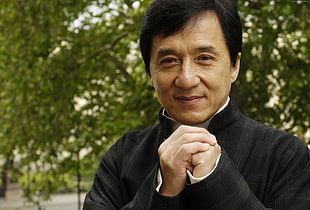 Jackie Chan wearing black top