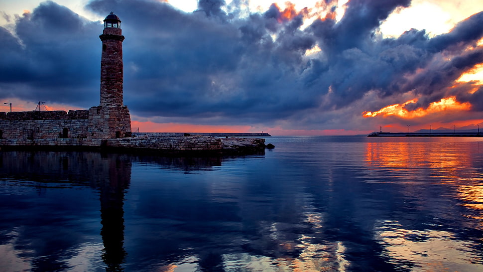 brown lighthouse, water, lighthouse, sky, sea HD wallpaper