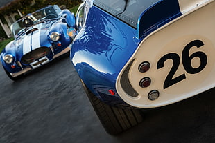 closeup photo of blue classic car