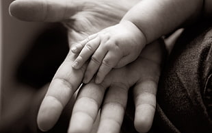 human palm and baby hand