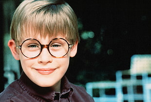 boy wearing black framed round-lens eyeglasses