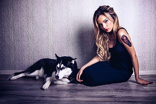 woman sitting on floor near dog HD wallpaper