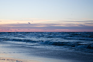 sea waves on shore during dawn