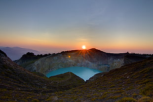 body of water sorounded with brown rocky mountain, kelimutu HD wallpaper