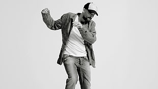 man in faded jeans while dancing