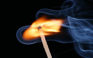 lit matchstick with smoke